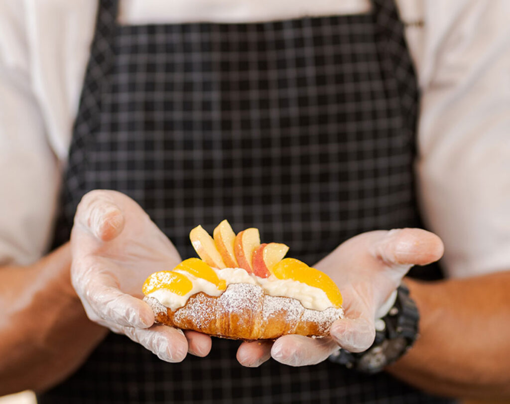 chef with apple desert